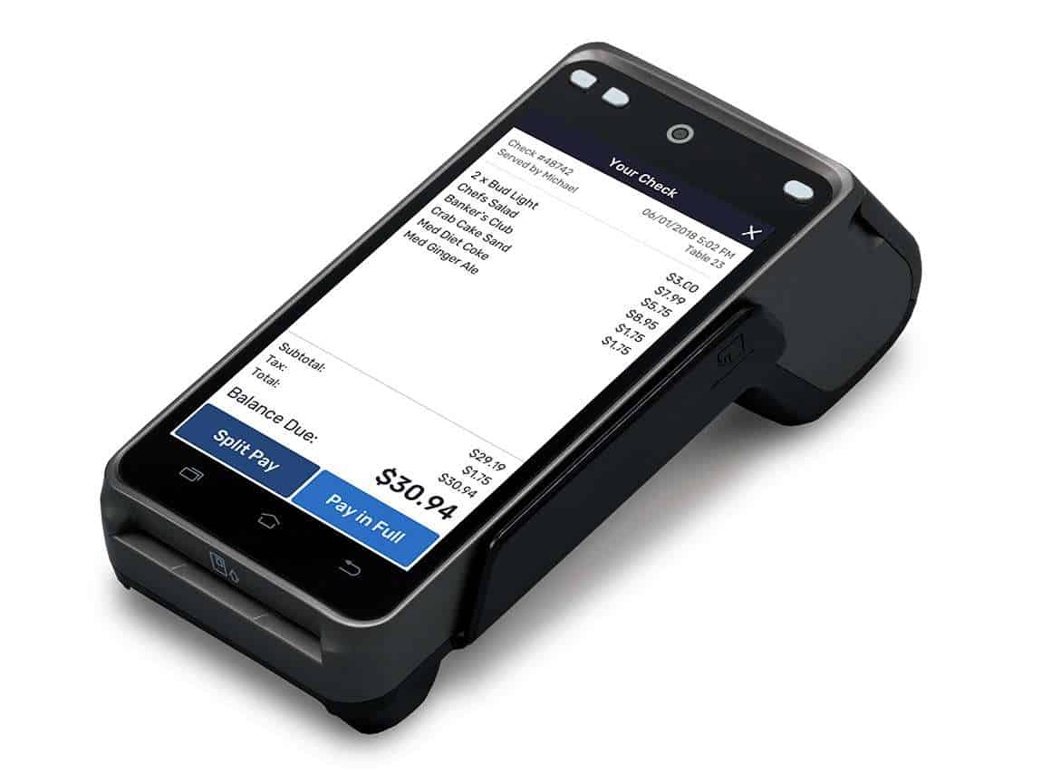 Merchant reviewing credit card processing statement fees